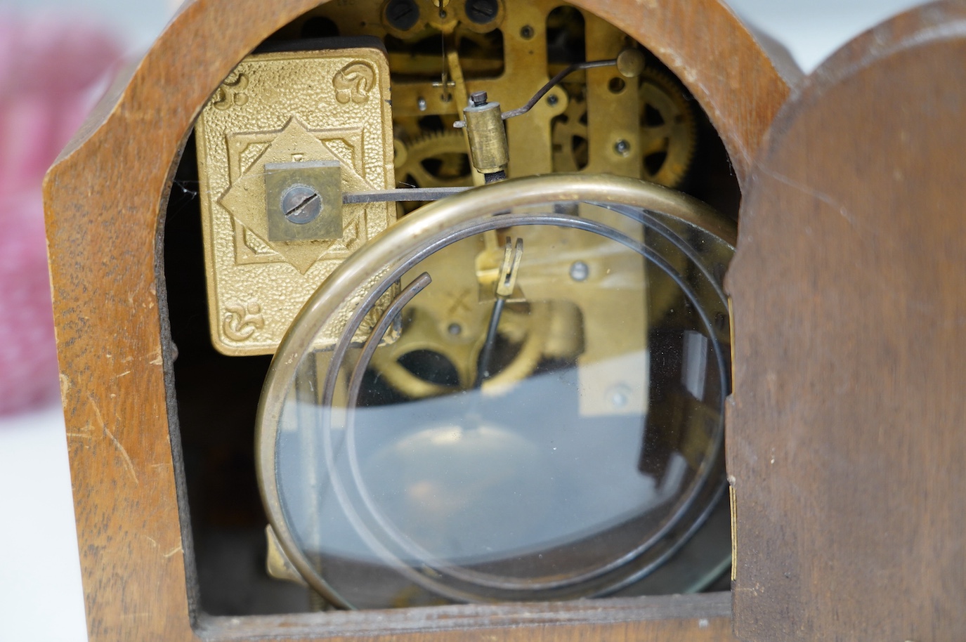 A late 19th century brass mounted burr walnut bracket clock with key and pendulum, and an oak mantel clock, tallest 37cm. Condition - poor to fair